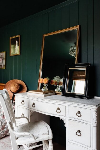 An antique mirror and decor styled on a vanity