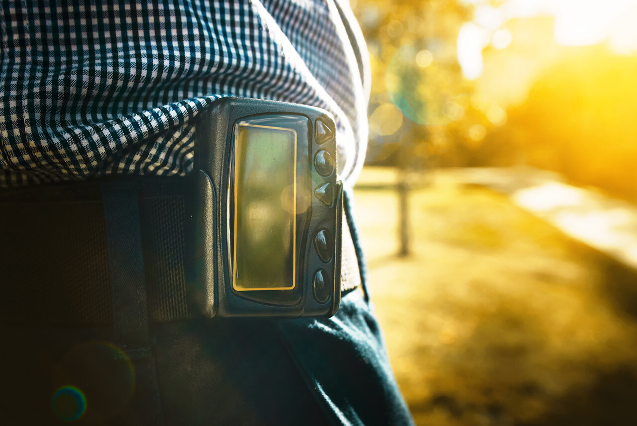 Man wearing pager on his belt.